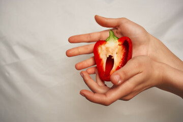 red pepper in hand ingredient healthy food vitamins