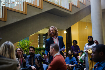 Speaker with microphone talking to audience