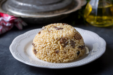 Turkish foods; Bulgur pilaf with mushrooms (Turkish name; mantarli bulgur pilavi)