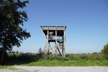 Wooden watchtower at the meadows on the edge of the Dutch city of Zaandam (Zaanse Schans). End of summer, September, Netherlands