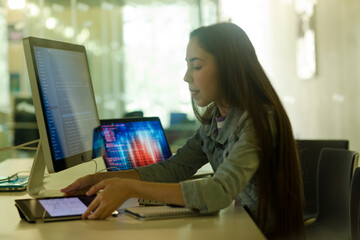 Student girl using computer at desk