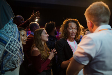 Speakers talking with audience