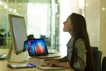 Student girl using computer at desk