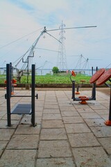 Fototapeta na wymiar Open gym workout area in the park near the river