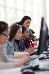 Students using computer in library