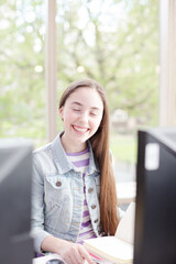 Portrait of girl using computer