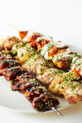 Chicken skewers with various sauces
