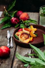 Sweet cheesecakes with peach in a plate close-up. Breakfast