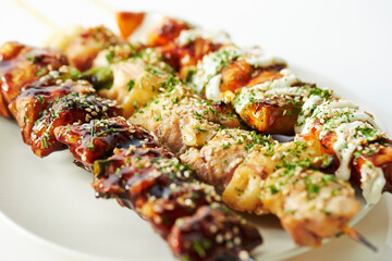 Chicken skewers with various sauces