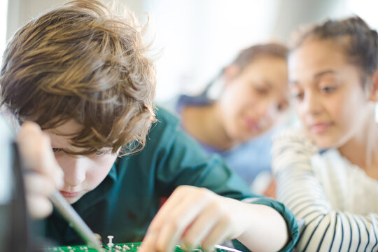 Students assembling model in classroom