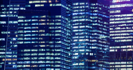 Fototapeta premium skyscrapers windows at night in Singapore