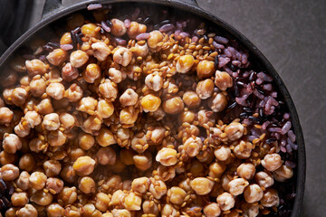 Chickpeas and mixed grain rice in a stone pot