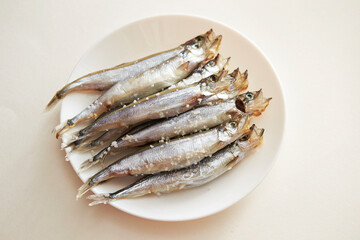 Salted small saltwater fish on a Plate