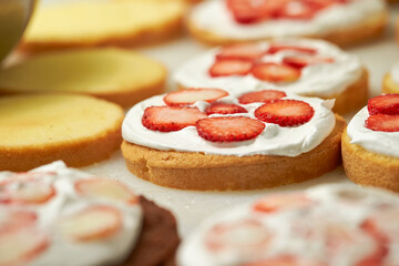 Making fresh cream strawberry cake