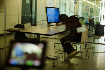 Boy student using computer at desk