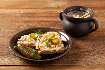 Sandwich with lard and pickled cucumber. Traditionally rendered lard with cracklings and onion.