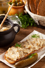Sandwich with lard and pickled cucumber. Traditionally rendered lard with cracklings and onion.