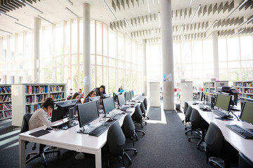 Students working on computers in library