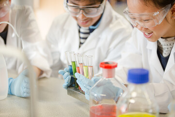 Students conducting scientific experiment in laboratory classroom