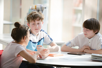 Fototapeta premium Students sitting together at table