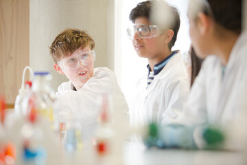 Students conducting scientific experiment in laboratory classroom
