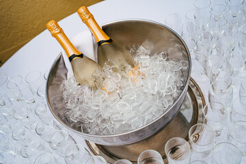 two bottles of champagne in a bucket of ice. cooling of alcoholic beverages  © andrey