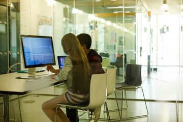 Students using computer at desk