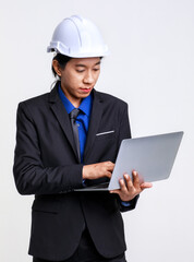 Asian professional successful male foreman industrial engineer in black formal suit and safety helmet standing on white background