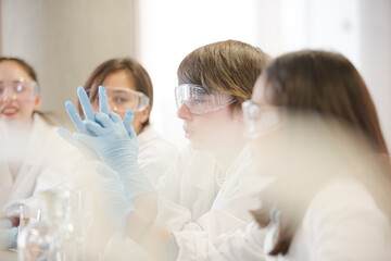 Students conducting scientific experiment in laboratory classroom