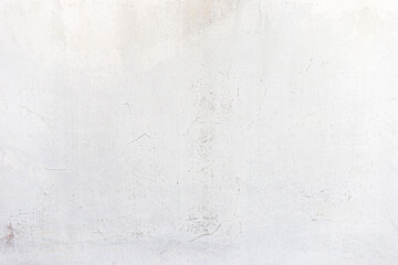 Old white cement wall background with cracks.