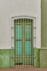 Antique dry green painted wood door facade with copy space