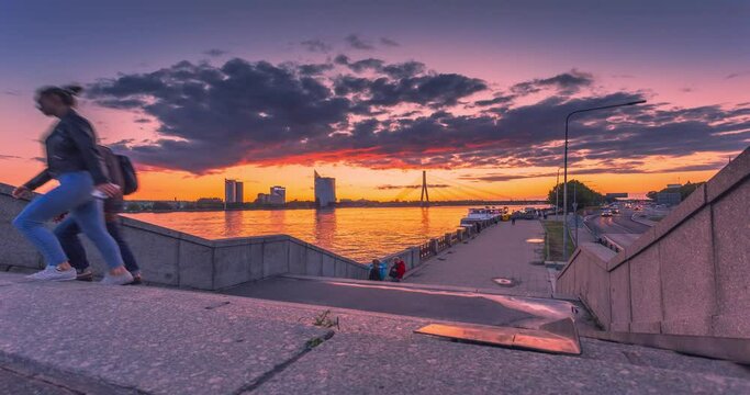 RIGA - LATVIA, people walking in the streets, sunset view with beautiful sky