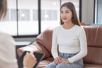 Obraz premium Young asian woman with mental health problem meet psychologist to consult and mental therapy. Psychology and mental therapy concept