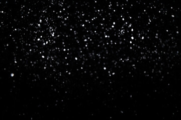 Small bokeh circles like snowfall on black background for overlay blending mode