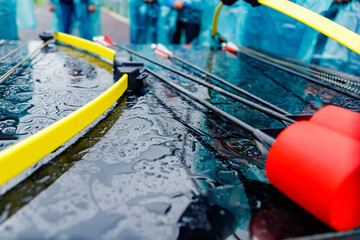 Archery with soft-tipped arrows lying on a table in the rain