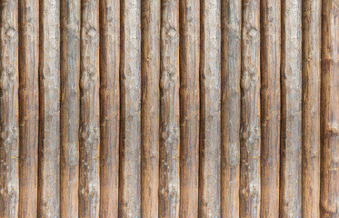 wooden pattern of vertical logs stacked parallel