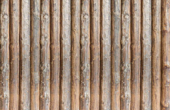 wooden pattern of vertical logs stacked parallel
