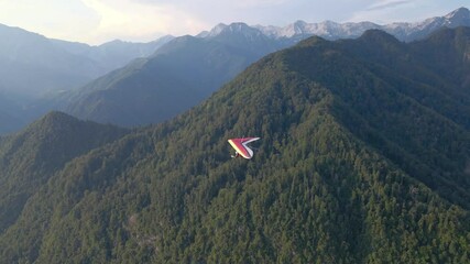 Hang glider in the Alps. Drone footage