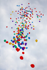 Party balloons floating into the sky