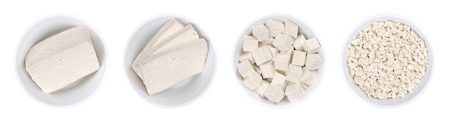 Processed white tofu, in white bowls. Single block, three slices,  cubes, and crumbled tofu. Bean curd, made of coagulated soy milk, a component of Asian cuisine and a meat substitute. Close-up. Photo - obrazy, fototapety, plakaty