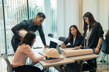 Engineer groups asian using notebook for business partners discussing documents and ideas at meeting and smiling happy for working