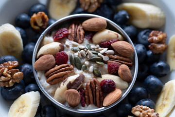 PLATING UP GOURMET BREAKFAST  PORRIDGE USING CHEFS COOKING RING FOR GREAT PRESENTATION 