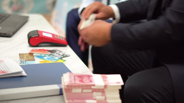 Cash in RMB by swiping card at POS.
