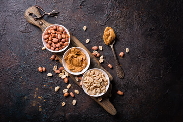 Obraz na płótnie Canvas Tasty peanut paste and nuts for breakfast