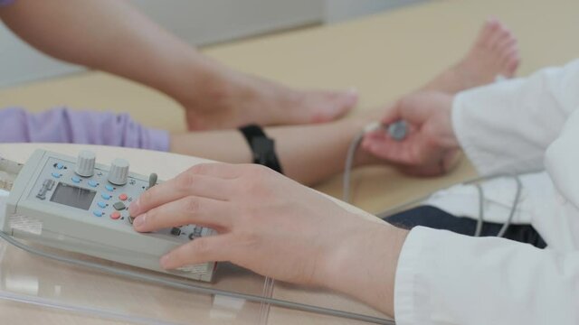 Patient nerves testing using electromyography at medical center