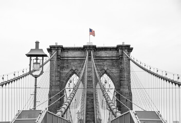 The American Flag flying over Brooklyn Bridge in New York City