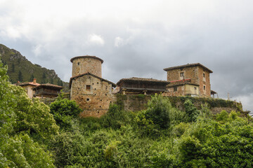 Fototapeta na wymiar Bandujo with the Tunón Tower in Asturias