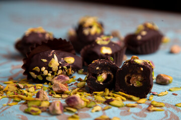 dates covered with chocolate and stuffed with pistachio 