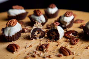 dates covered with white chocolate and stuffed with pecan