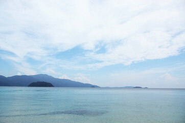 THAILAND, BANGKOK: Scenic landscape view of isolated Thai island with palms and traditional houses